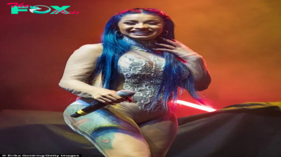 rin Rapper Cardi B rocks a see-through leotard and debuts her blue locks at a concert in New Orleans