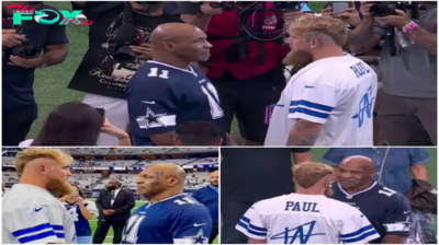 Jake Paul Mocks a Gloomy-Looking Mike Tyson on the Big Screen Following the Dallas Cowboys Game Pitching Match .Linh