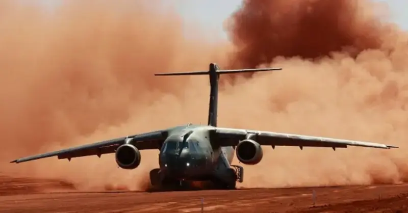 Military transport aircraft C-390 Embraer Millennium tests crushed stone runway