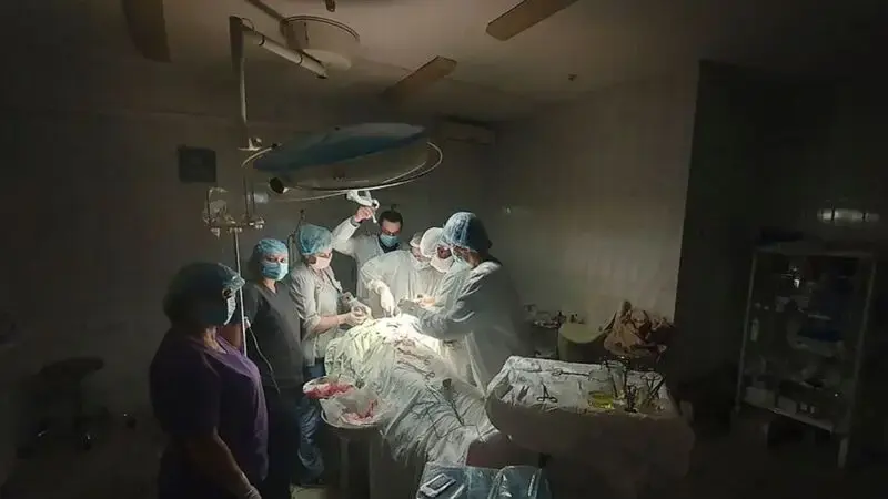 Surgeons work by flashlight as Ukraine power grid battered