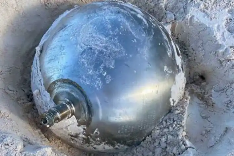 A strange metallic ball with inscriptions falls from the sky in the Bahamas