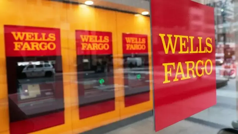 Wells Fargo 4Q profit falls by half but tops expectations