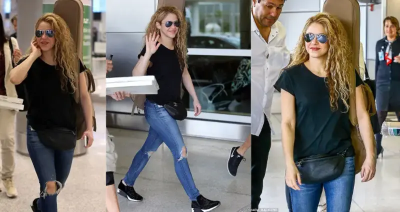 Whenever, Wherever! Shakira carries a guitar strapped to her back as she jets into Miami from Europe