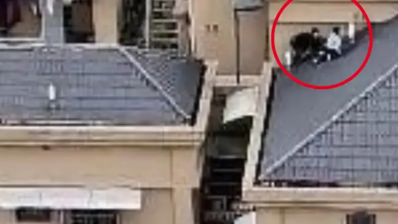 Terrifying moment kids spotted climbing steep roof of 15-storey apartment block