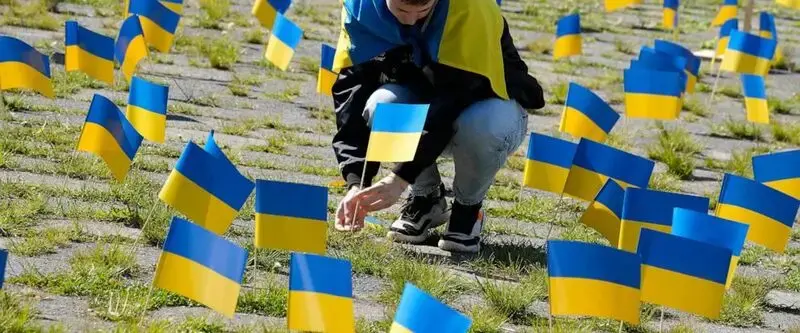Ukraine flags block Russian ambassador's path on Victory Day