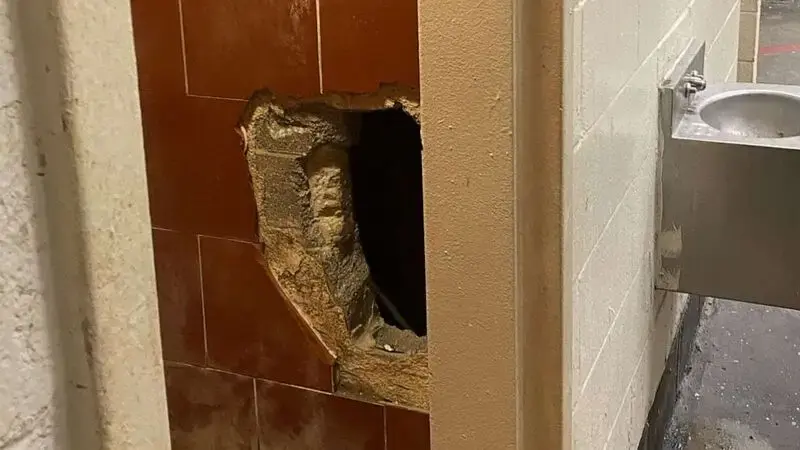 Inmate tunnels through wall, stabs man in neighboring cell, prison officials say