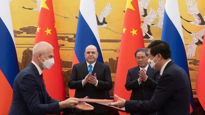 On Beijing visit, Russian prime minister says pressure from West is strengthening ties with China