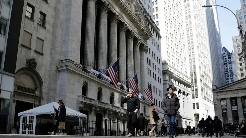 Stock market today: Wall Street turns lower after Fed hints at more rate hikes