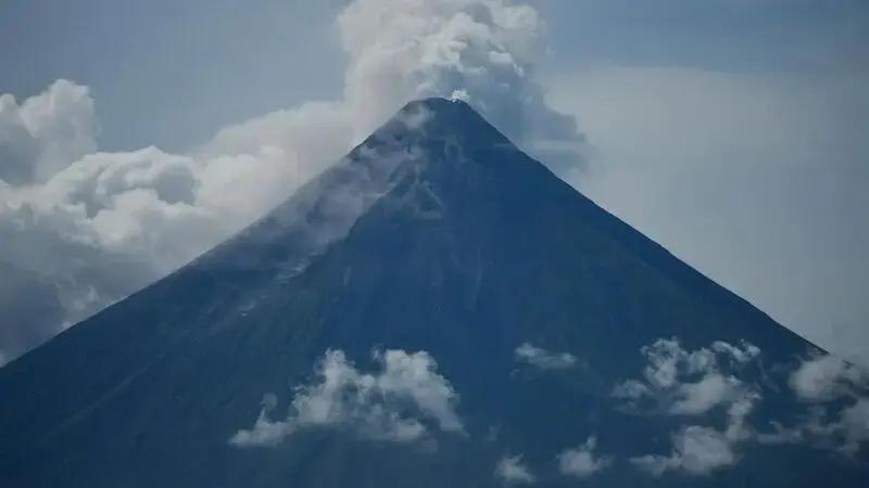 Poor villagers risk their lives in danger zone as Philippines' most active volcano erupts
