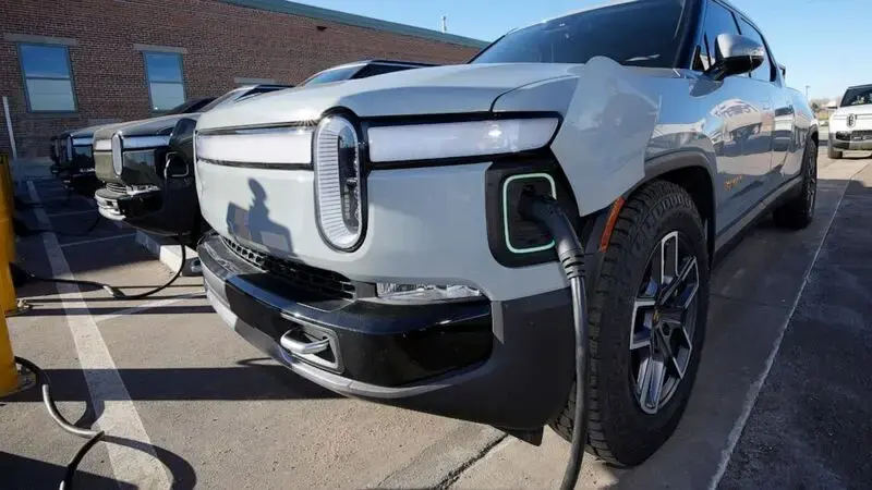 Electric vehicle maker Rivian to join Tesla charging network as automakers consider company's plug