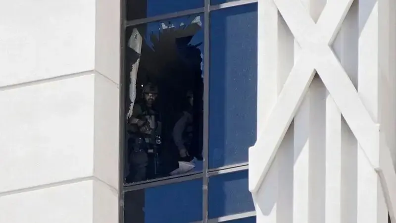 Hostage freed after hourslong standoff at Las Vegas Strip resort room, police say