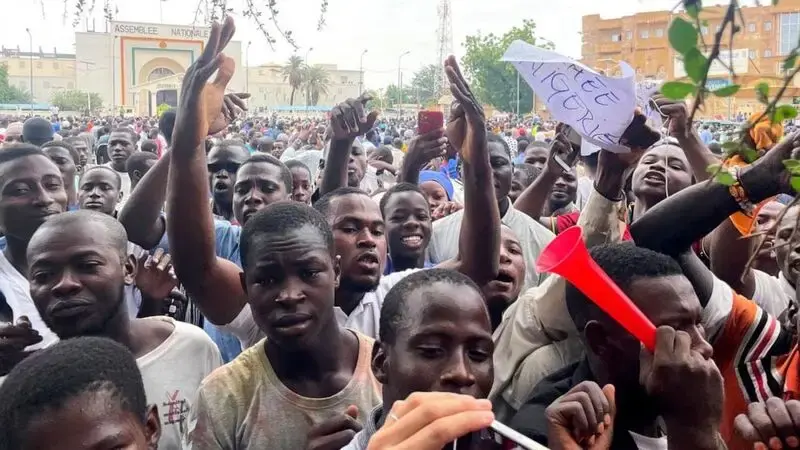 Supporters of Niger's coup march through the capital waving Russian flags and denouncing France