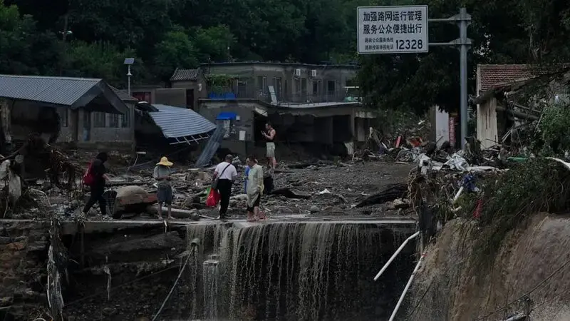 At least 20 dead and 27 missing in floods surrounding China's capital Beijing, thousands evacuated