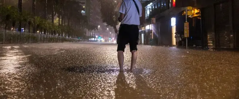 Rain floods Hong Kong streets and subway stations