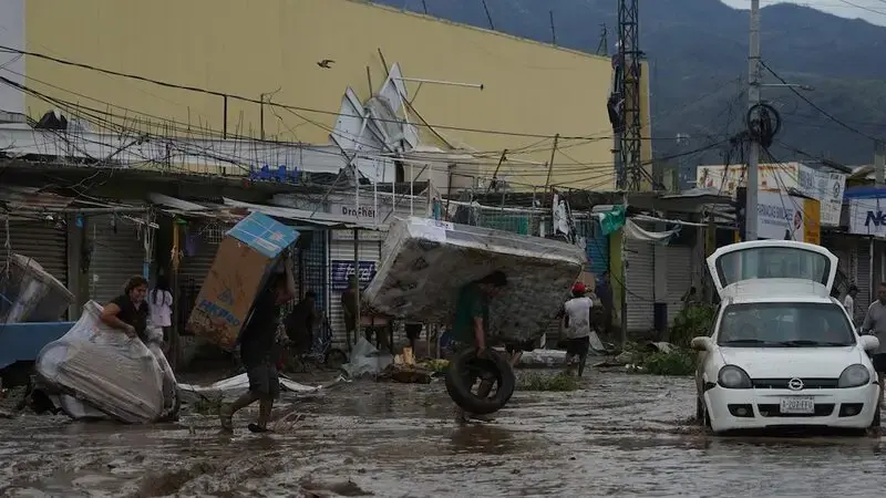 Acapulco residents are left in flooded and windblown chaos with hurricane's toll still unknown