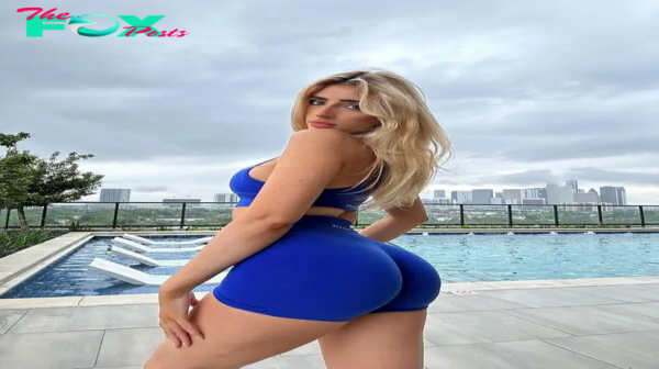 Supermodel Skyler Springstun captivates onlookers as she confidently showcases her alluring curves in a form-fitting blue swimsuit.