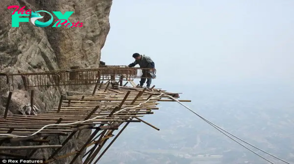 FS Scariest job in the world: Meet the workers building a 3ft wide wooden road on a steep cliff ‎