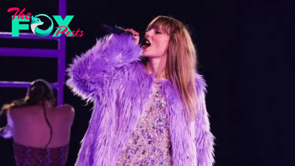 C5/Taylor Swift’s Enchanting Performance: Radiant Beauty in Purple Dress Charms Audiences