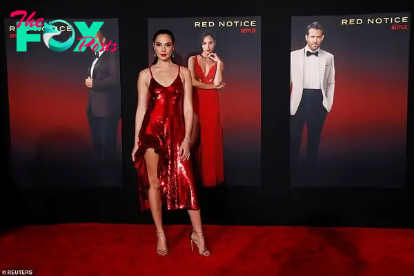 B83.Dazzling in Red: Gal Gadot Shines with Dwayne Johnson and Ryan Reynolds at Red Notice Premiere in LA