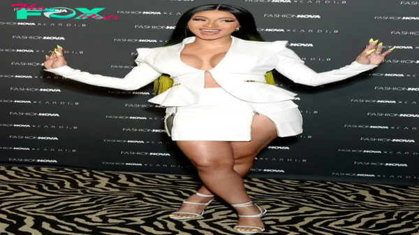 rin Cardi B flaunts the consequences of her boob work as she puts on an eye-popping show in a white cowhide two-piece at send off of new dress line