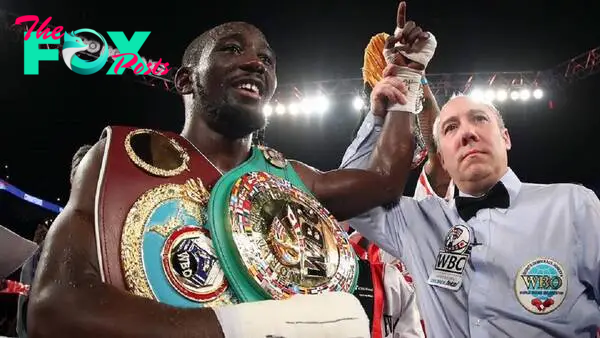 With a win over Israil Madrimov, what world titles does Terence Crawford now hold?