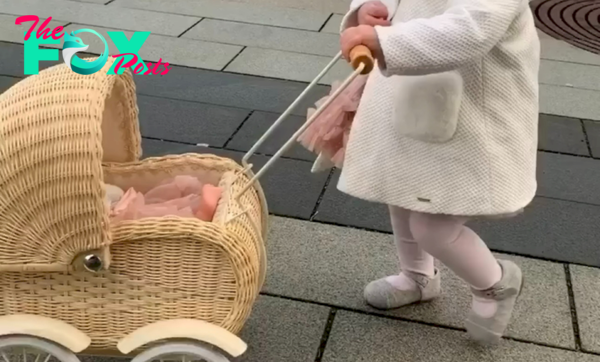 Funny and adorable pictures of baby pushing his doll stroller