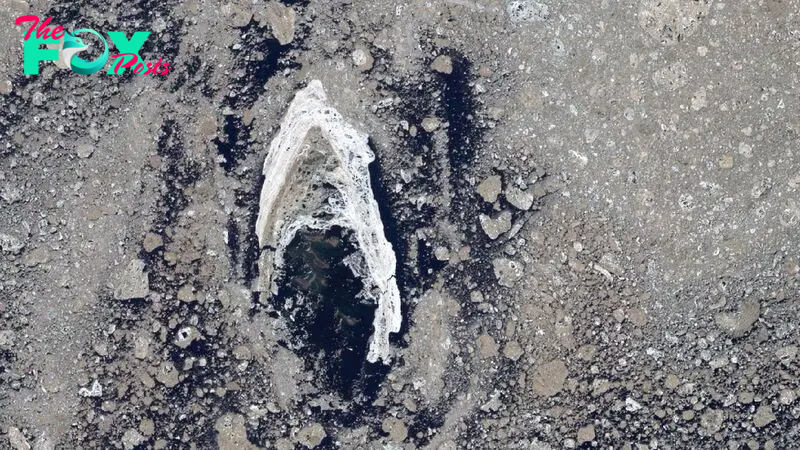 Earth from space: Iconic 'Star Trek' symbol shines brightly in sea of muddy Arctic sea ice